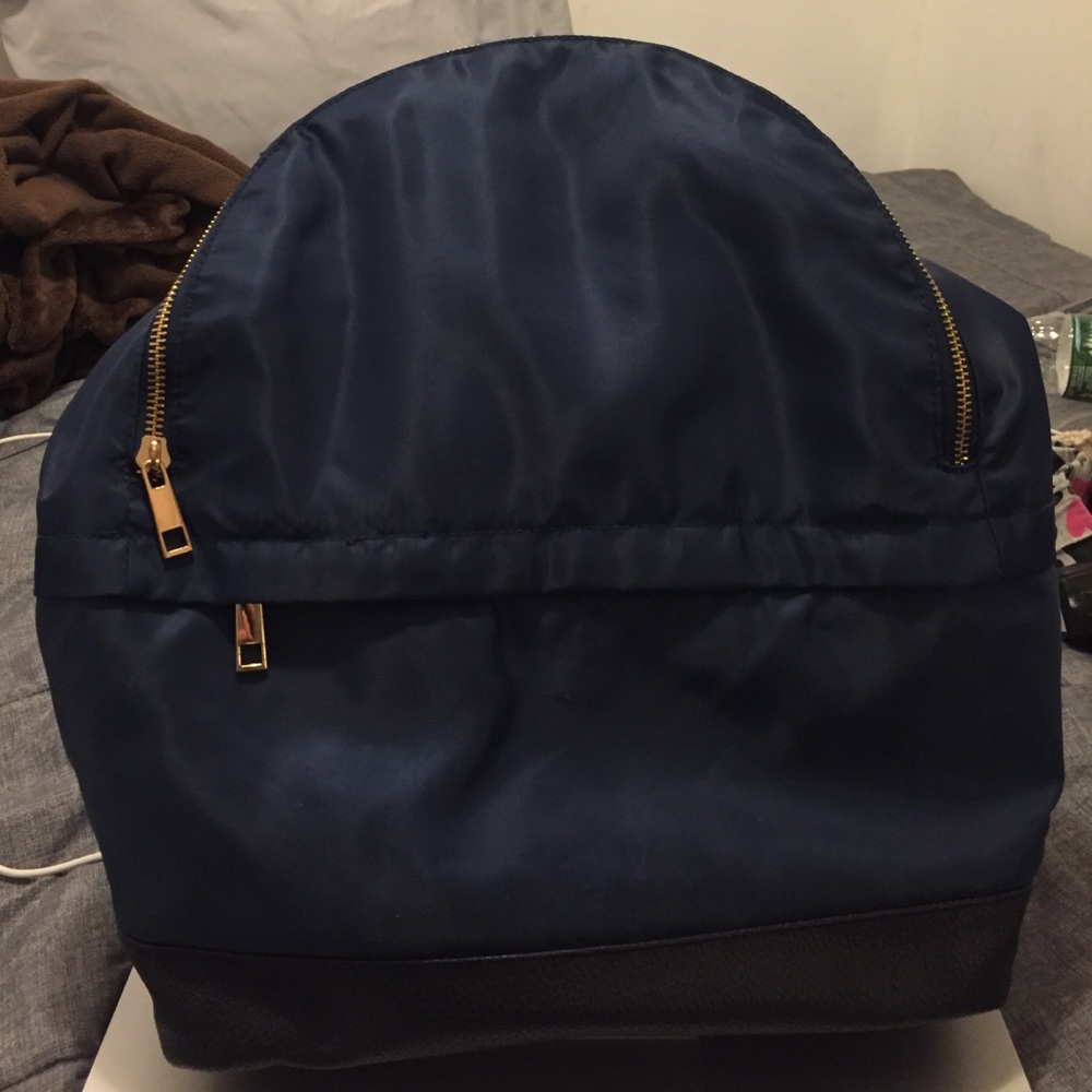 A navy blue book bag
